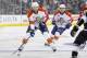 Florida Panthers defenseman Tom Gilbert (77) and teammate center Vincent Trocheck (67) bring the puck up the ice during the first period of an NHL hockey game against the Los Angeles Kings, Saturday, March 22, 2014, in Los Angeles. (AP Photo/Gus Ruelas)