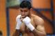BOLTON, ENGLAND - MARCH 24: Amir Khan shadow boxes during a media workout at the Gloves Community Centre on March 24, 2014 in Bolton, England. (Photo by Alex Livesey/Getty Images)