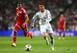 MADRID, SPAIN - APRIL 23: Cristiano Ronaldo of Real Madrid takes on Jerome Boateng of Bayern Muenchen during the UEFA Champions League semi-final first leg match between Real Madrid and FC Bayern Muenchen at the Estadio Santiago Bernabeu on April 23, 2014 in Madrid, Spain. (Photo by Paul Gilham/Getty Images)