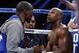 Floyd Mayweather Jr., right, listens to his father and coach Floyd Mayweather between rounds against Canelo Alvarez during a 152-pound title fight, Saturday, Sept. 14, 2013, in Las Vegas. (AP Photo/Eric Jamison)