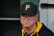 Pittsburgh Pirates manager Clint Hurdle stands in the dugout before a baseball game between the Pittsburgh Pirates and the Milwaukee Brewers in Pittsburgh Thursday, April 17, 2014. The Pirates won 11-2. (AP Photo/Gene J. Puskar)