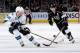 LOS ANGELES, CA - APRIL 28: Dustin Brown #23 of the Los Angeles Kings skates with the puck against Matt Irwin #52 of the San Jose Sharks in Game Six of the First Round of the 2014 Stanley Cup Playoffs at Staples Center on April 28, 2014 in Los Angeles, California. (Photo by Noah Graham/NHLI via Getty Images)