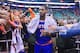 Fans reach for New York Knicks' Carmelo Anthony (7) as he walks off the court following their NBA basketball game against the Utah Jazz Monday, March 31, 2014, in Salt Lake City. The Knicks won 92-83. (AP Photo/Rick Bowmer)