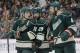 Minnesota Wild left wing Zach Parise (11) talks with right wing Jason Pominville (29) and defenseman Clayton Stoner (4) before a face-off during the second period of Game 6 of an NHL hockey first-round playoff series against the Colorado Avalanche in St. Paul, Minn., Monday, April 28, 2014. (AP Photo/Ann Heisenfelt)