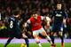 LONDON, ENGLAND - FEBRUARY 12: Mesut Ozil (C) of Arsenal takes on Juan Mata (L) of Manchester United during the Barclays Premier League match between Arsenal and Manchester United at the Emirates Stadium on February 12, 2014 in London, England. (Photo by Michael Regan/Getty Images)