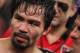 Manny Pacquiao stands in the ring following his victory over Timothy Bradley in their WBO welterweight title boxing fight Saturday, April 12, 2014, in Las Vegas. (AP Photo/Isaac Brekken)
