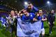 BOLTON, ENGLAND - APRIL 22: Marcin Wasilewski (top), Chris Wood and Matty James (R) of Leicester City celebrate winning the Championship with goalkeeper Kasper Schmeichel (L) after the Sky Bet Championship match between Bolton Wanderers and Leicester City at Reebok Stadium on April 22, 2014 in Bolton, England. (Photo by Michael Regan/Getty Images)