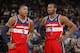 OAKLAND, CA - JANUARY 28: Bradley Beal #3 chats with teammate John Wall #2 of the Washington Wizards while facing the Golden State Warriors on January 28, 2014 at Oracle Arena in Oakland, California. NOTE TO USER: User expressly acknowledges and agrees that, by downloading and or using this photograph, user is consenting to the terms and conditions of Getty Images License Agreement. Mandatory Copyright Notice: Copyright 2014 NBAE (Photo by Rocky Widner/NBAE via Getty Images)