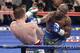 Floyd Mayweather Jr. throws a punch against Canelo Alvarez during a 152-pound title fight, Saturday, Sept. 14, 2013, in Las Vegas. (AP Photo/Isaac Brekken)