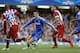 Chelsea's Fernando Torres, centre tries to get past Atletico's Miranda, left during the Champions League semifinal second leg soccer match between Chelsea and Atletico Madrid at Stamford Bridge Stadium in London Wednesday, April 30, 2014. (AP Photo/Kirsty Wigglesworth)