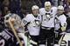 Pittsburgh Penguins' Sidney Crosby, left, Evgeni Malkin, center, of Russia, and Matt Niskanen celebrate Malkin's goal against the Columbus Blue Jackets during the first period of Game 6 of a first-round NHL playoff hockey series Monday, April 28, 2014, in Columbus, Ohio. (AP Photo/Jay LaPrete)