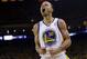 FILE - In this April 27, 2014, file photo, Golden State Warriors' Stephen Curry celebrates after scoring against the Los Angeles Clippers during the first half in Game 4 of an opening-round NBA basketball playoff series in Oakland, Calif.