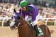 In a photo provided by Benoit Photo, California Chrome and jockey Victor Espinoza win the Santa Anita Derby horse race Saturday, April 5, 2014, at Santa Anita in Arcadia, Calif. (AP Photo/Benoit Photo)