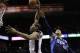 San Antonio Spurs' Kawhi Leonard, left, scores past Dallas Mavericks' Monta Ellis (11) during the first half of Game 5 of the opening-round NBA basketball playoff series on Wednesday, April 30, 2014, in San Antonio. (AP Photo/Eric Gay)