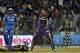 Kolkata Knight Riders Sunil Narine celebrates the dismissal of Mumbai Indians' Rohit Sharma during an Indian Premier League (IPL) cricket match in Mumbai, India, Wednesday, May 16, 2012. (AP Photo/ Rajanish Kakade)