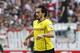 Dortmund's Mats Hummels runs with the ball during a match of German Bundesliga between VfB Stuttgart and Borussia Dortmund in Stuttgart, Germany, Saturday, March 29, 2014. (AP Photo/Michael Probst)