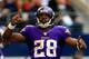 ARLINGTON, TX - NOVEMBER 03: Running back Adrian Peterson #28 of the Minnesota Vikings celebrates after a touchdown during the game against the Dallas Cowboys at Cowboys Stadium on November 3, 2013 in Arlington, Texas. (Photo by Jamie Squire/Getty Images)