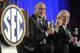 FILE - In this May 2, 2013 file photo, ESPN President John Skipper, left, and Southeastern Conference Commissioner Mike Slive address the media during a news conference announcing the launching of the SEC Network in partnership with ESPN, in Atlanta. ESPN is cutting its workforce, the latest Disney division to reduce staff. While announcing cuts Tuesday, ESPN will still be expanding in other areas. (AP Photo/John Amis, File)
