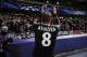 Leverkusen's Lars Bender, celebrates with supporters after his team won the match, 1-0, against Real Sociedad, during their Champions League Group A soccer match at Anoeta stadium in San Sebastian, northern Spain on Tuesday, Dec. 10, 2013. (AP Photo/Alvaro Barrientos)