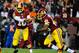 Nov 25, 2013; Landover, MD, USA; Washington Redskins quarterback Robert Griffin III (10) hands the ball off to Washington Redskins running back Alfred Morris (46) during the first half at FedEx Field. Mandatory Credit: Brad Mills-USA TODAY Sports