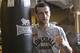 Carl Froch poses for a photograph beside a boxing bag following his workout at Trinity Gym in New York, Tuesday, Nov. 29, 2011. Froch is preparing to face Andre Ward on Dec. 17 in Atlantic City, N.J. (AP Photo/Kathy Willens)