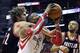 Houston Rockets' Dwight Howard (12) is grabbed around the neck by Portland Trail Blazers' Robin Lopez (42) as Nicolas Batum (88) stands near in the second half of Game 5 of an opening-round NBA basketball playoff series Wednesday, April 30, 2014, in Houston. Lopez was charged with a flagrant-1 foul for the move. The Rockets won 108-98 to send the teams back to Portland for Game 6. (AP Photo/Pat Sullivan)