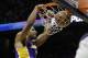 Los Angeles Lakers forward Xavier Henry (7) scores against the Atlanta Hawks in the second half of an NBA basketball game, Monday, Dec. 16, 2013, in Atlanta. The Hawks won 114-100. (AP Photo/John Bazemore)