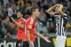 Juventus forward Fernando Llorente, right, touches his head during the Europa League semifinal second leg soccer match between Juventus and Benfica at the Juventus stadium, in Turin, Italy, Thursday, May 1, 2014. (AP Photo/ Massimo Pinca)