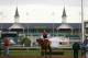 LOUISVILLE, KY - MAY 01: California Chrome walks off the track with trainer Art Sherman in front of the twin spires during early morning workouts at Churchill Downs on May 1, 2014 in Louisville, Kentucky. (Photo by Kevin C. Cox/Getty Images)