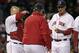 Boston Red Sox starting pitcher Felix Doubront, right, hands the ball to manager John Farrell as he is taken out while trailing the New York Yankees during the third inning of a baseball game on Thursday, April 24, 2014, in Boston. Red Sox catcher David Ross, left, attends. (AP Photo/Charles Krupa)
