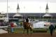LOUISVILLE, KY - MAY 01: California Chrome walks off the track with trainer Art Sherman in front of the twin spires during early morning workouts at Churchill Downs on May 1, 2014 in Louisville, Kentucky. (Photo by Kevin C. Cox/Getty Images)