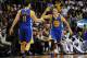 Jan 2, 2014; Miami, FL, USA; Golden State Warriors point guard Stephen Curry (right) greets teammate Golden State Warriors shooting guard Klay Thompson (left) during the second half against the Miami Heat at American Airlines Arena. Mandatory Credit: Steve Mitchell-USA TODAY Sports