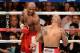 LAS VEGAS, NV - MAY 05: (L-R) Floyd Mayweather Jr. smiles in the ring against Miguel Cotto during their WBA super welterweight title fight at the MGM Grand Garden Arena on May 5, 2012 in Las Vegas, Nevada. (Photo by Ethan Miller/Getty Images)