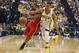 Apr 28, 2014; Indianapolis, IN, USA; Atlanta Hawks guard Jeff Teague (0) battles for a loose ball with Indiana Pacers guard George Hill (3) in game five of the first round of the 2014 NBA Playoffs at Bankers Life Fieldhouse. Mandatory Credit: Brian Spurlock-USA TODAY Sports