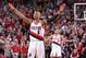 PORTLAND, OR - APRIL 25: Damian Lillard #0 of the Portland Trail Blazers celebrates against the Houston Rockets in Game Three of the Western Conference Quarterfinals during the 2014 NBA Playoffs on April 25, 2014 at the Moda Center in Portland, Oregon. NOTE TO USER: User expressly acknowledges and agrees that, by downloading and or using this photograph, User is consenting to the terms and conditions of the Getty Images License Agreement. Mandatory Copyright Notice: Copyright 2014 NBAE (Photo by Sam Forencich/NBAE via Getty Images)