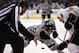 Los Angeles Kings center Jarret Stoll, center, and Anaheim Ducks center Ryan Getzlaf face off as a linesman drops the puck during the second period of an NHL hockey game, Saturday, April 12, 2014, in Los Angeles. (AP Photo/Mark J. Terrill)