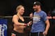 ANAHEIM, CA - FEBRUARY 23: Ronda Rousey celebrates her UFC Bantamweight Title over Liz Carmouche with a member of her team at Honda Center on February 23, 2013 in Anaheim, California. (Photo by Jeff Gross/Getty Images)