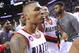 Portland Trail Blazers' Damian Lillard, center, celebrates with teammates his winning shot against the Houston Rockets during the last .9 of a second of game six of an NBA basketball first-round playoff series game in Portland, Ore., Friday May 2, 2014. The Trail Blazers won the series in a 99-98 win. (AP Photo/Greg Wahl-Stephens)
