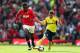 MANCHESTER, ENGLAND - MAY 03: Emanuele Giaccherini of Sunderland is challenged by Danny Welbeck of Manchester United during the Barclays Premier League match between Manchester United and Sunderland at Old Trafford on May 3, 2014 in Manchester, England. (Photo by Clive Mason/Getty Images)