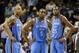 Oklahoma City Thunder players Caron Butler (2), Kendrick Perkins (5) and Kevin Durant (35) wait for play to resume in the second half of Game 6 of an opening-round NBA basketball playoff series against the Memphis Grizzlies Thursday, May 1, 2014, in Memphis, Tenn. Oklahoma City won 104-84 to even the series 3-3. (AP Photo/Mark Humphrey)