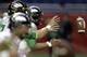 Oregon's Marcus Mariota takes a snap as he prepares for the Valero Alamo Bowl NCAA college football game against Texas, Monday, Dec. 30, 2013, in San Antonio. (AP Photo/Eric Gay)