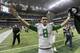 Oregon's Marcus Mariota runs toward fans following the Valero Alamo Bowl NCAA college football game against Texas, Monday, Dec. 30, 2013, in San Antonio. Oregon won 30-7. (AP Photo/Eric Gay)