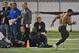 Scouts time Georgia Tech NCAA college football running back Robert Godhigh, right, during his 40 yard sprint on NFL pro day Friday, March 28, 2014, in Atlanta. (AP Photo/David Tulis)
