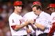 ANAHEIM, CA - MAY 02: ANAHEIM, CA - MAY 02 : David Freese #6 of the Los Angeles Angels of Anaheim is checked by trainer Adam Nevala after being hit by a pitch in the hand in the third inning against the Texas Rangers at Angel Stadium of Anaheim on May 2, 2014 in Anaheim, California. Freese later left the game. (Photo by Stephen Dunn/Getty Images)