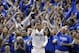 Fans cheer as Dallas Mavericks' Monta Ellis (11) celebrates after scoring and being fouled by the San Antonio Spurs in the second half of Game 6 of an NBA basketball first-round playoff series on Friday, May 2, 2014, in Dallas. The Mavericks won 113-111. (AP Photo/Tony Gutierrez)