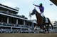 LOUISVILLE, KY - MAY 03: Jockey Victor Espinoza celebrates atop of California Chrome #5 after crossing the finish line to win the 140th running of the Kentucky Derby at Churchill Downs on May 3, 2014 in Louisville, Kentucky. (Photo by Matthew Stockman/Getty Images)
