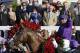 Victor Espinoza celebrates after riding California Chrome to victory in the 140th running of the Kentucky Derby horse race at Churchill Downs Saturday, May 3, 2014, in Louisville, Ky. (AP Photo/David Goldman)