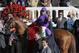 Victor Espinoza celebrates after riding California Chrome to a victory during the 140th running of the Kentucky Derby horse race at Churchill Downs Saturday, May 3, 2014, in Louisville, Ky. (AP Photo/David J. Phillip)
