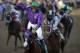 Victor Espinoza rides California Chrome to a victory during the 140th running of the Kentucky Derby horse race at Churchill Downs Saturday, May 3, 2014, in Louisville, Ky. (AP Photo/David J. Phillip)