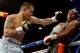 LAS VEGAS, NV - MAY 03: (L-R) Marcos Maidana throws a left at Floyd Mayweather Jr. during their WBC/WBA welterweight unification fight at the MGM Grand Garden Arena on May 3, 2014 in Las Vegas, Nevada. (Photo by Harry How/Getty Images)